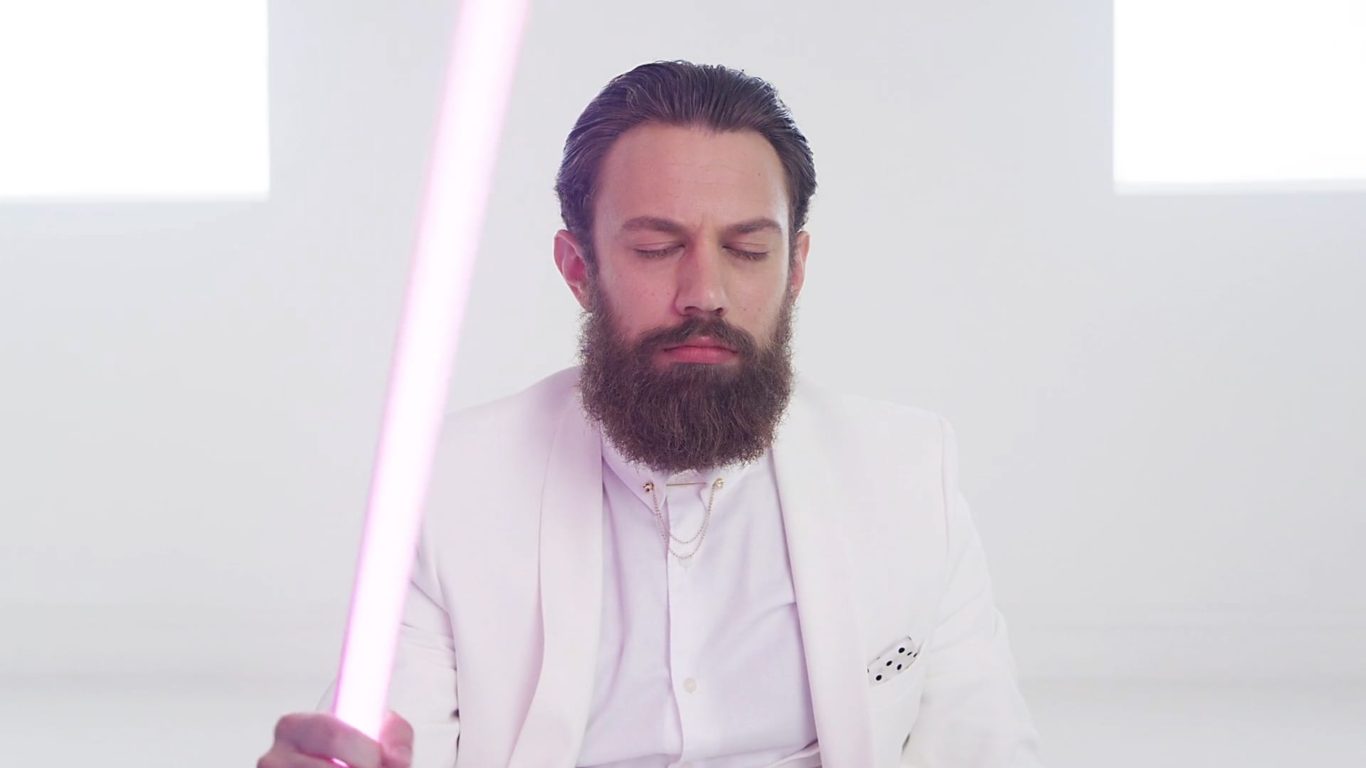E.on Internal Engagement Campaign — Bearded man in white suit meditating and holding glowing rod